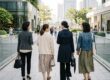 Chinese women with different modern styles walking together in an Asian city, seen from behind
